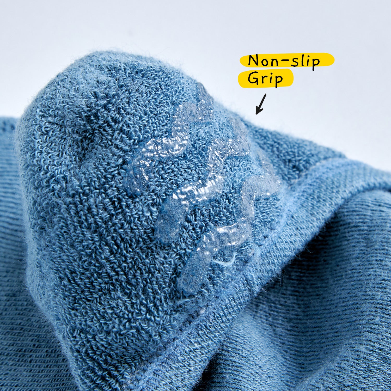 Close-up of non-slip heel grip inside no-show sock, featuring PVC traction for a secure, stay-put fit.