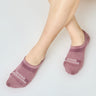 Model wearing purple no-show socks with “Ohana Sunshine” logo, showing moisture wicking mesh, arch design and snug fit over the foot
