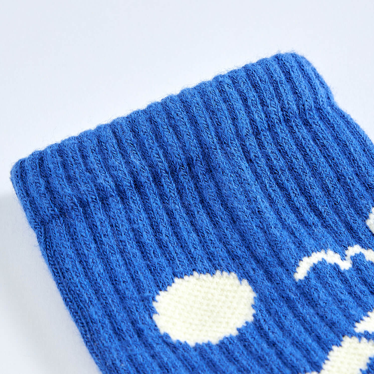 Detailed view of elastic ribbed cuff built to hold socks in place for a no-slip fit